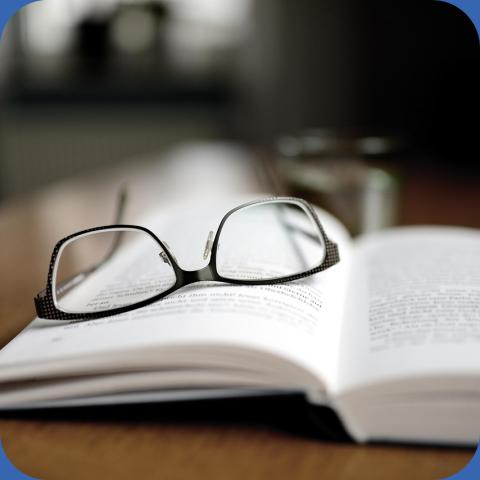 Reading glasses on a book for Christian Römmer